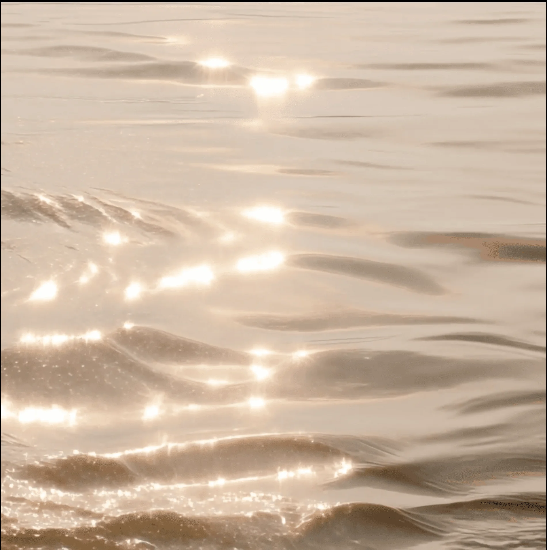 Sunlight shimmering on water, used as a brand mood texture for Dream Beauty